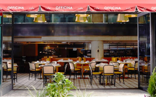 Café entrance at 1615 L Street NW with open glass doors and indoor-outdoor dining.