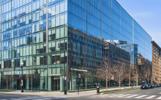 Exterior photo of 2001 M Street NW in Washington DC showing the Class A office building and corner retail frontage.